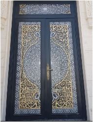 Ornamental stainless steel double door with laser-cut panels