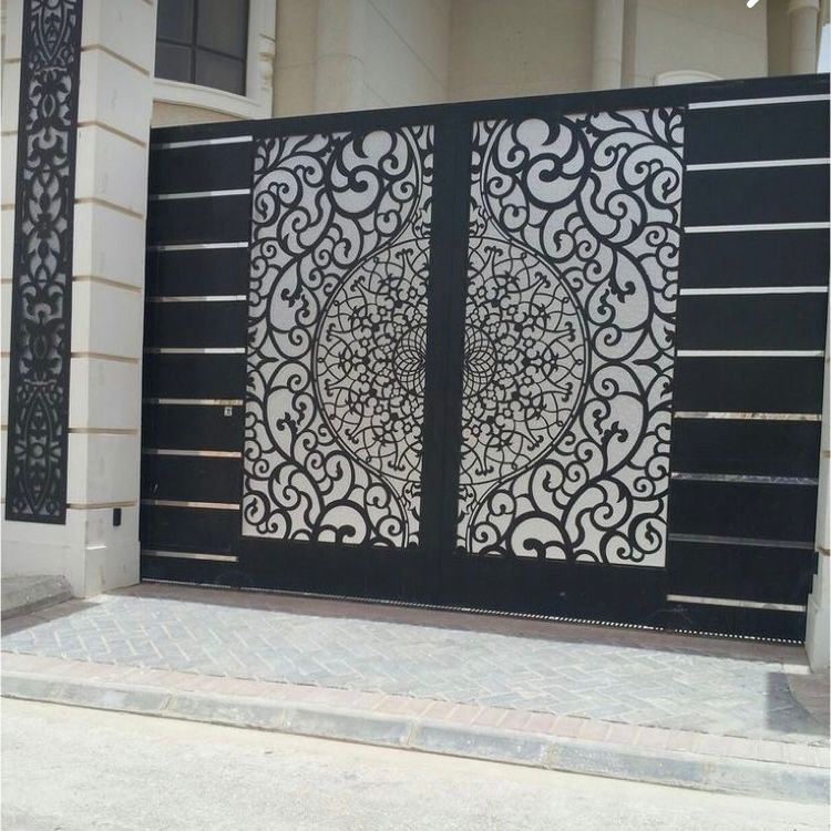 Ornate black metal entrance gate with decorative scrollwork