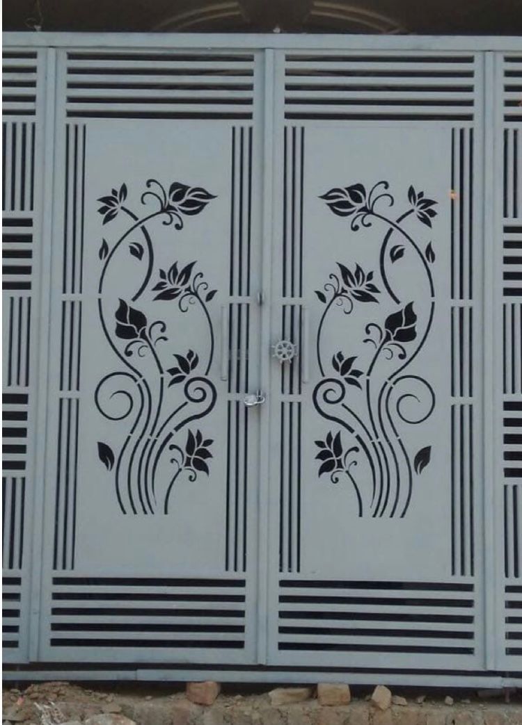 Metal gate with laser-cut floral pattern panels